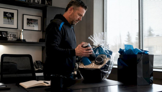 Hockey coach reviewing personalized gifts at home