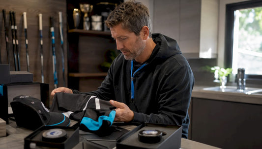 Hockey coach reviewing various gift items
