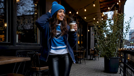 Woman in stylish hockey game outfit at arena concourse